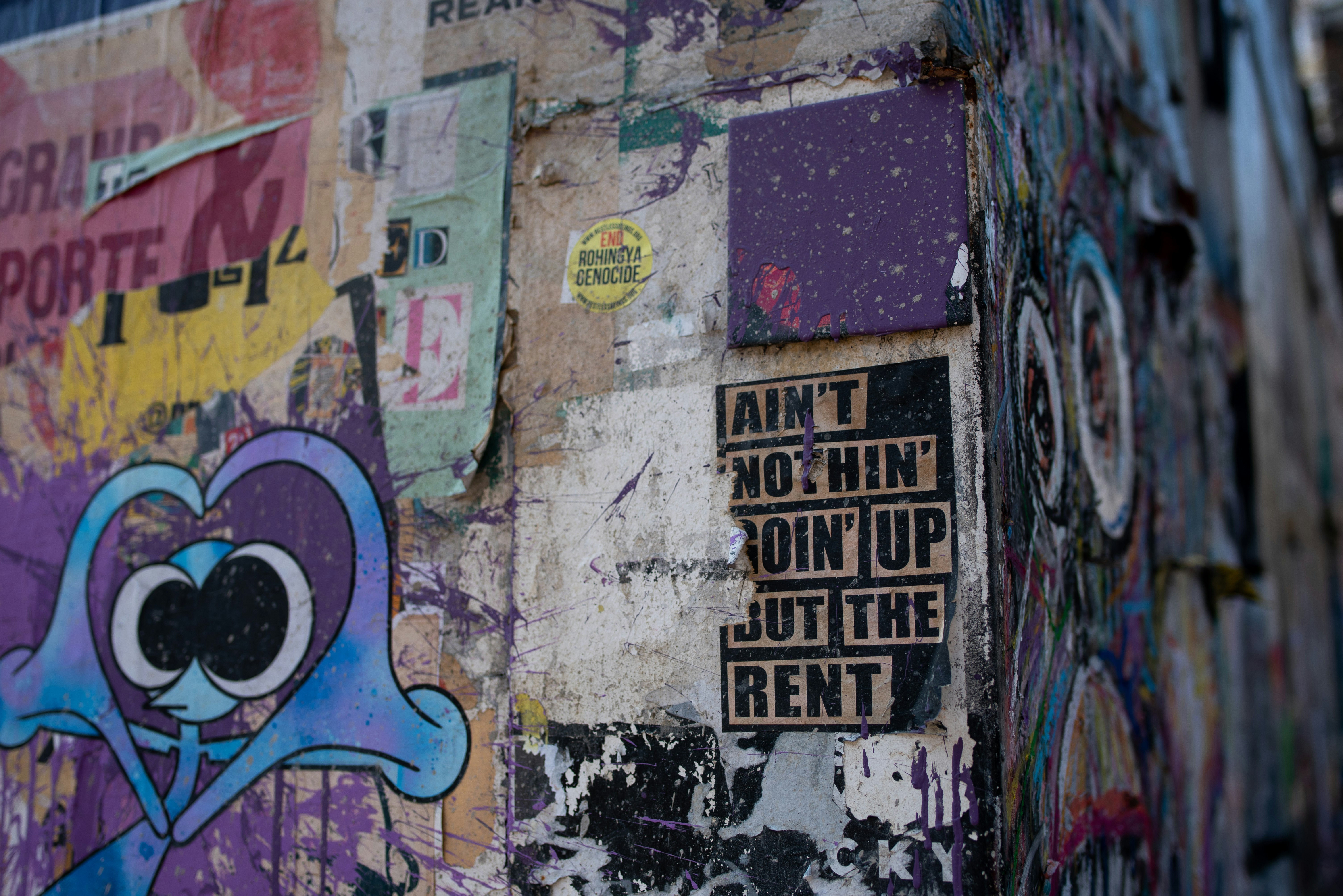 purple, blue, and black graffiti wall
